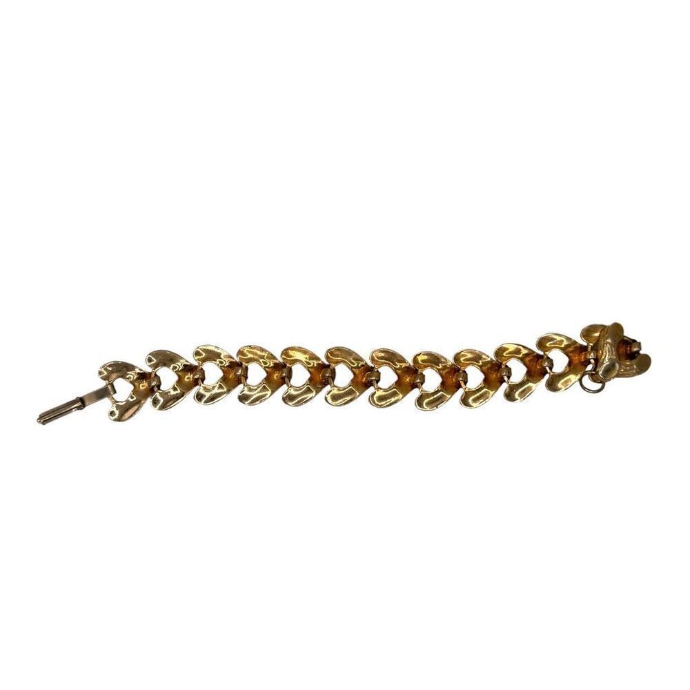 Unmarked gold colored link heart bracelet